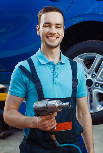 repairman with a checklist car service station