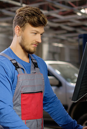 specialist near car diagnostic pc in a workshop
