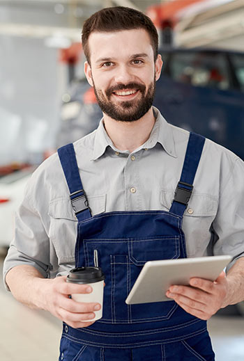 smiling worker in car service