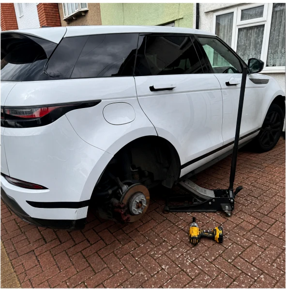 Onsite tyre fitting for an SUV at a customer location